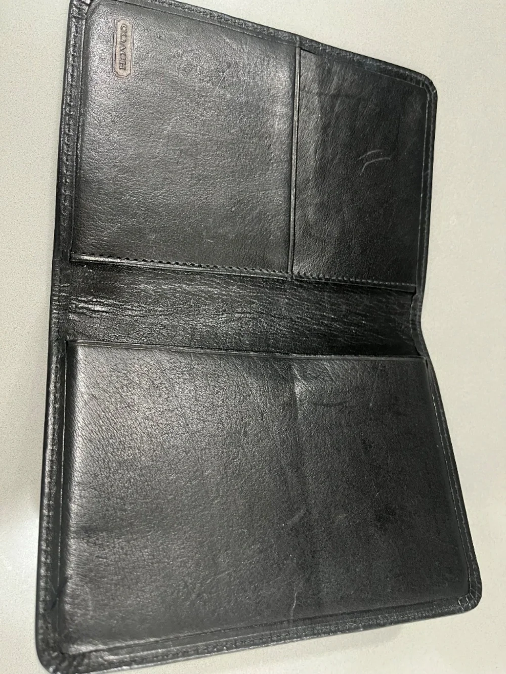 Coach black passport